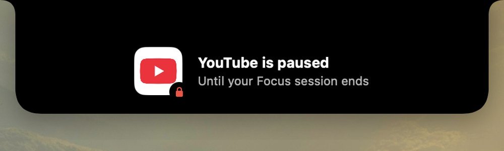 A notch message: YouTube is paused until your Focus session ends.